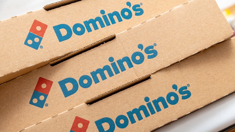 Domino's pizza boxes stacked