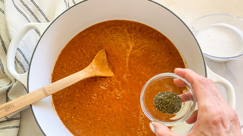 adding thyme to pot