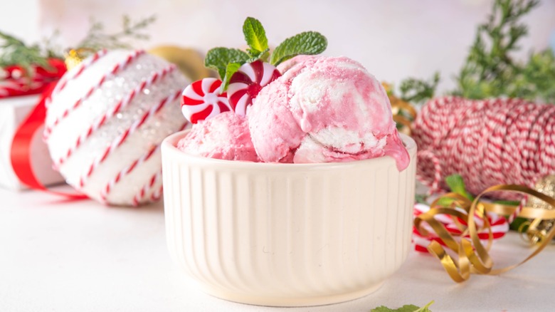 A bowl of candy cane ice cream in a holiday tableau