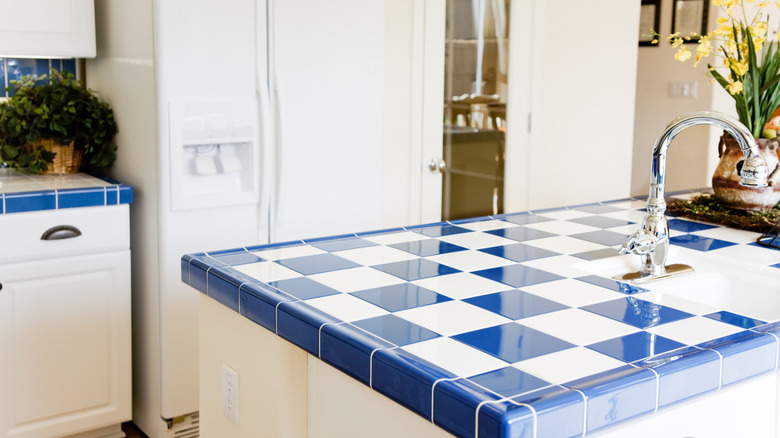 Kitchen with blue checkered tiled counters