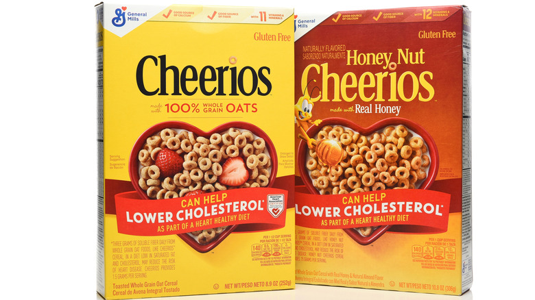 One box each of Cheerios and Honey Nut Cheerios on a white background