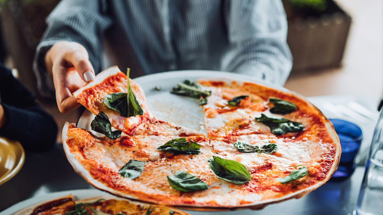 diner enjoy fresh pizza