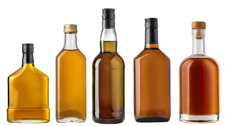 Five whiskey bottles