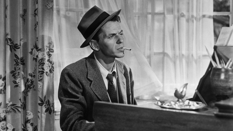 Frank Sinatra sitting at a piano